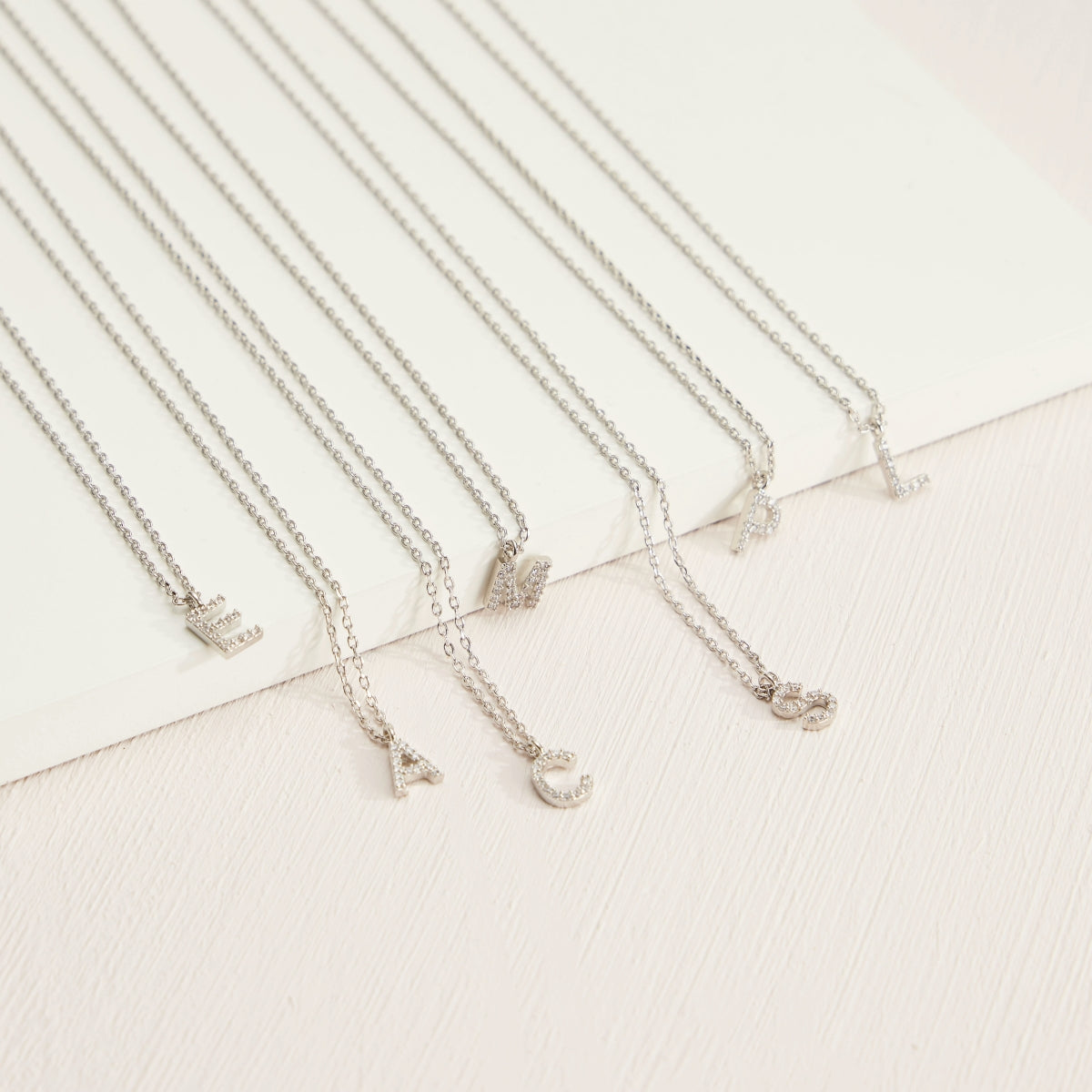 12 Gold-Plated Initial Necklaces with Cubic Zirconia Detailing