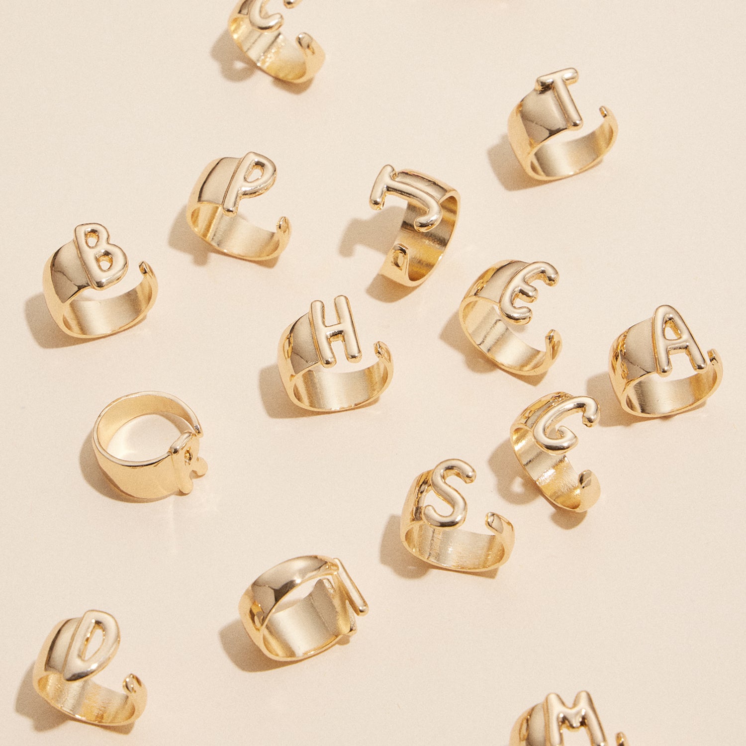 Bubble Shaped Initial Rings in Gold