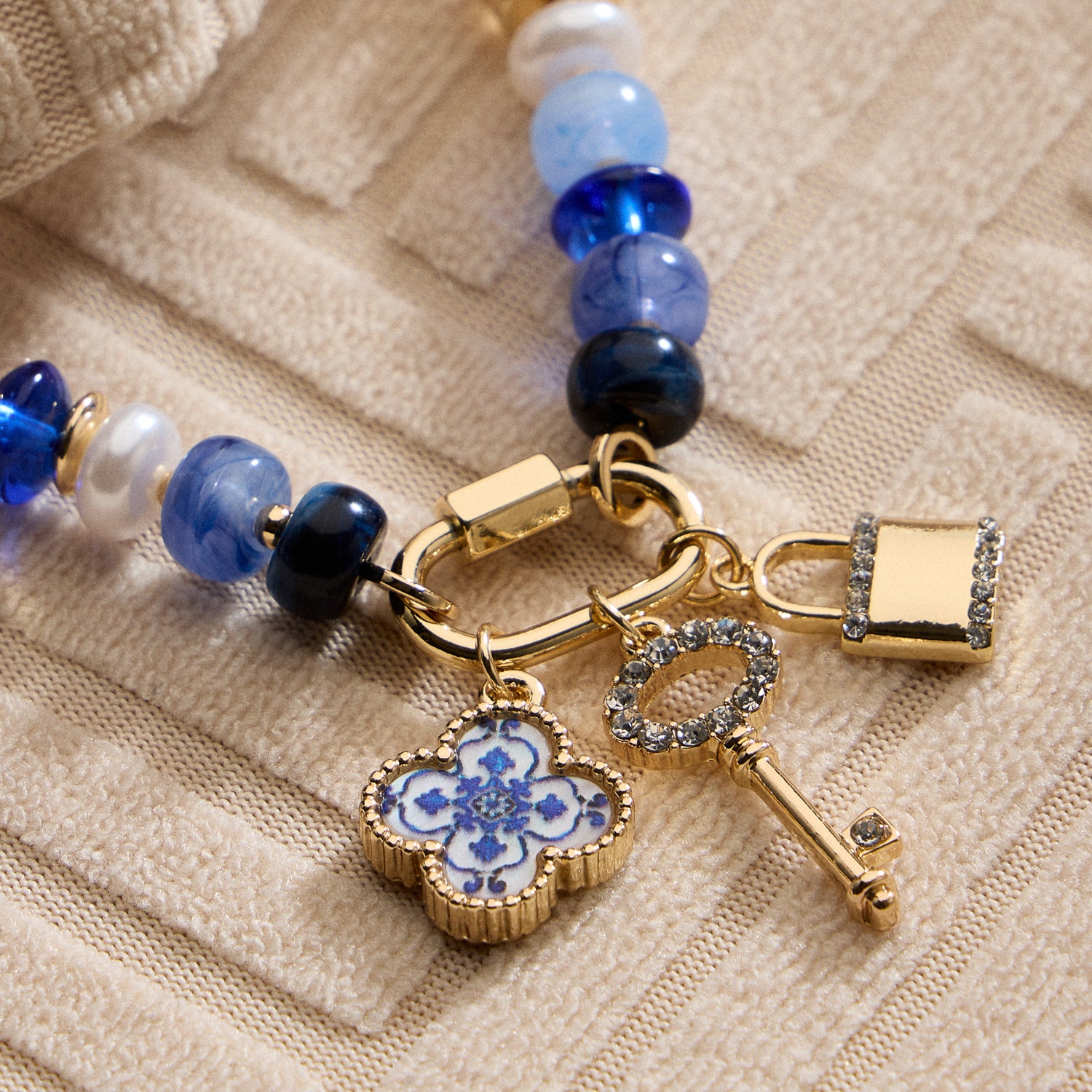 Vibrant Beaded Bracelet with Gold-Tone Trio Charms