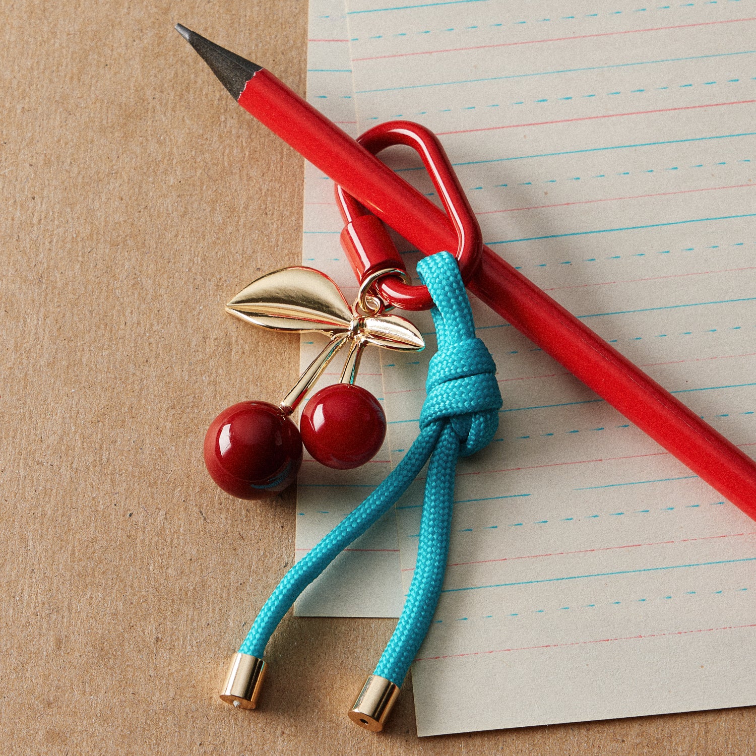 Gold-Tone Cherry Enamel Keychain | Braided Rope Detail