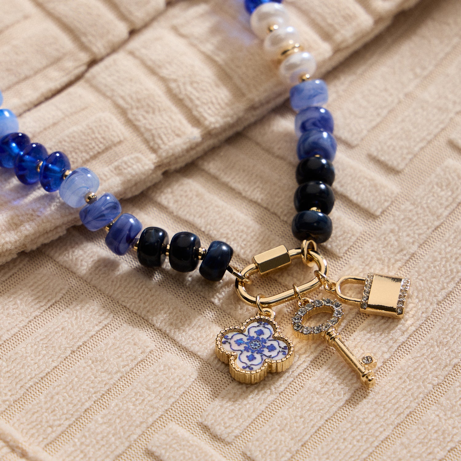 Layered Glass Bead Necklace with Trio of Charms