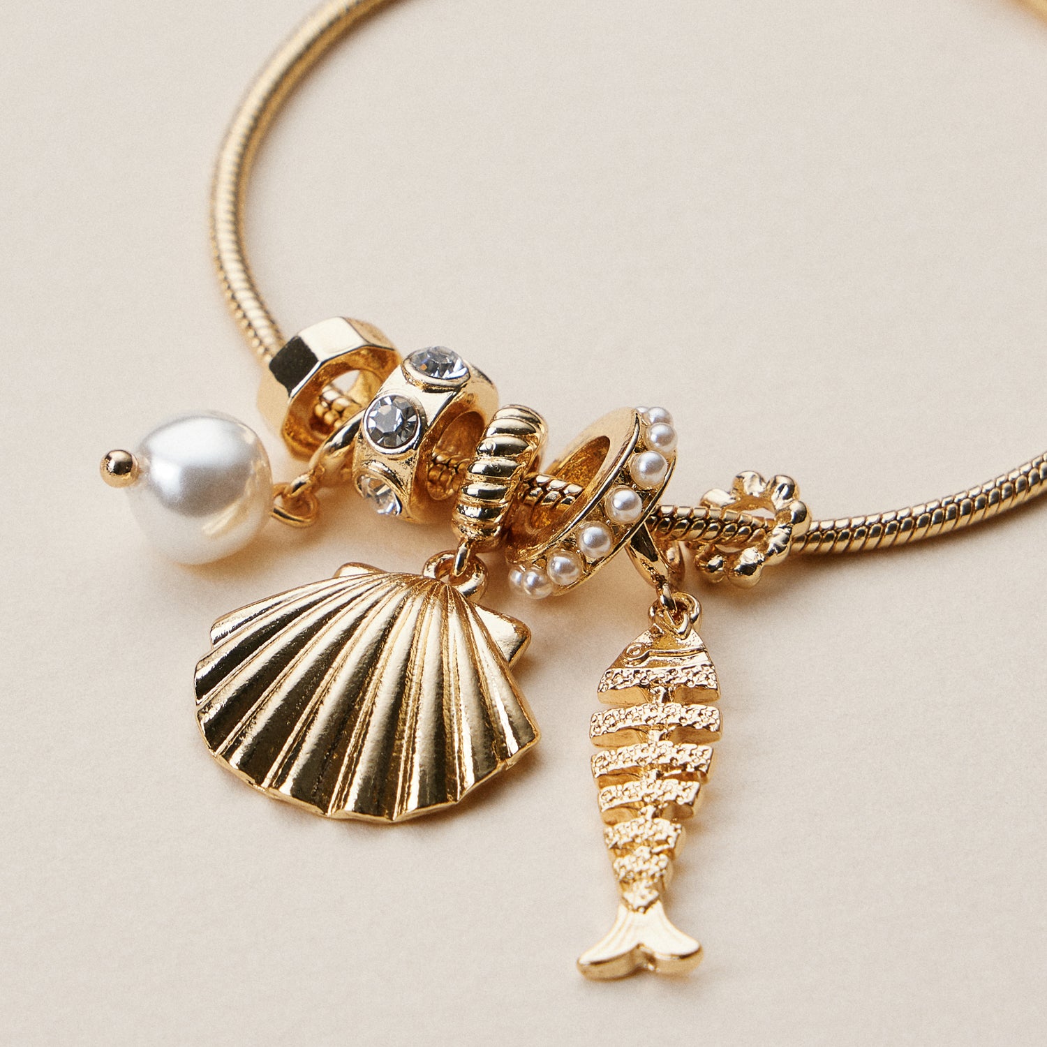 Gold Dipped Multi Charm Bracelet – Symbolic Pendant Collection