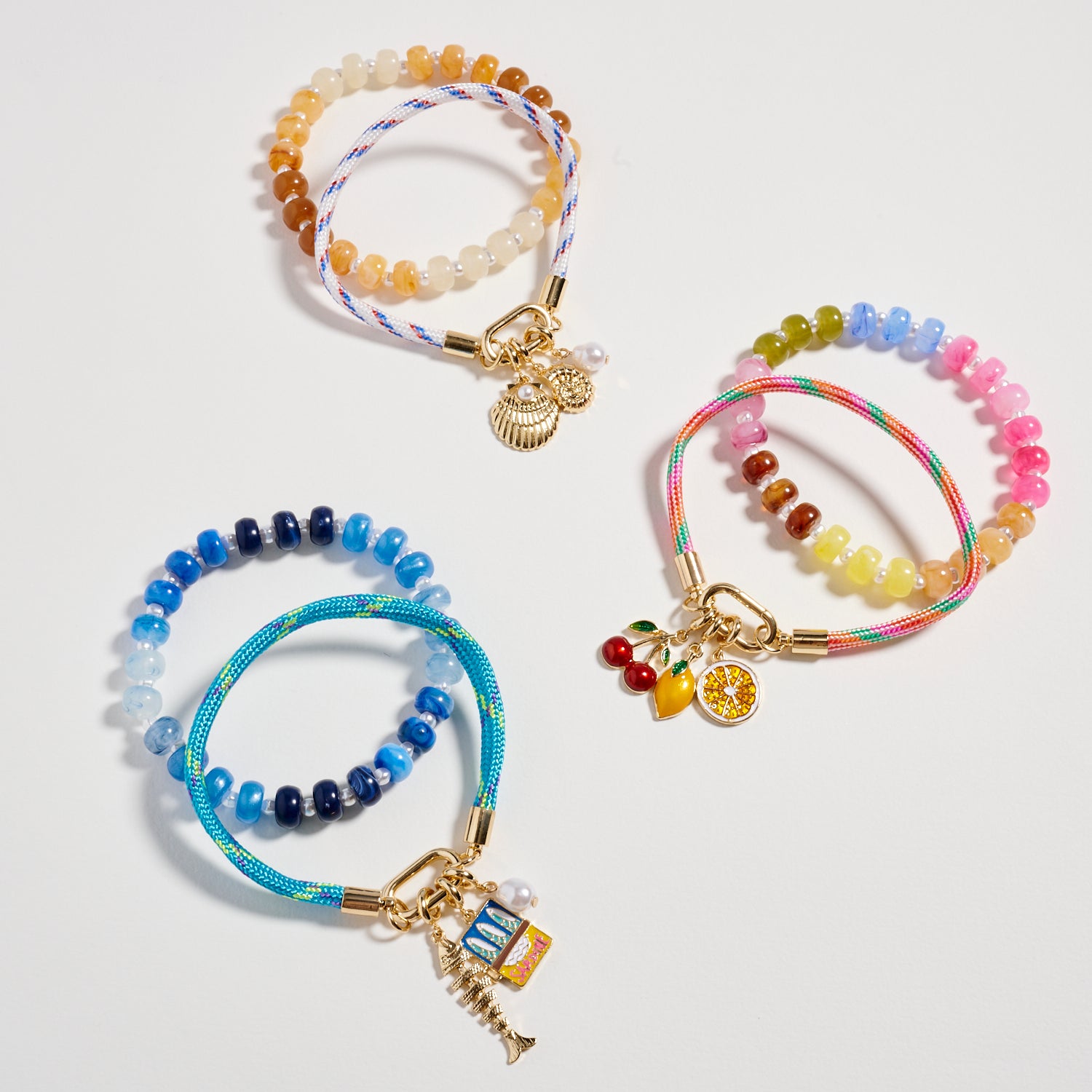 Double Layer Beaded Stretch & Cord Bracelet with Gold Tone Charms