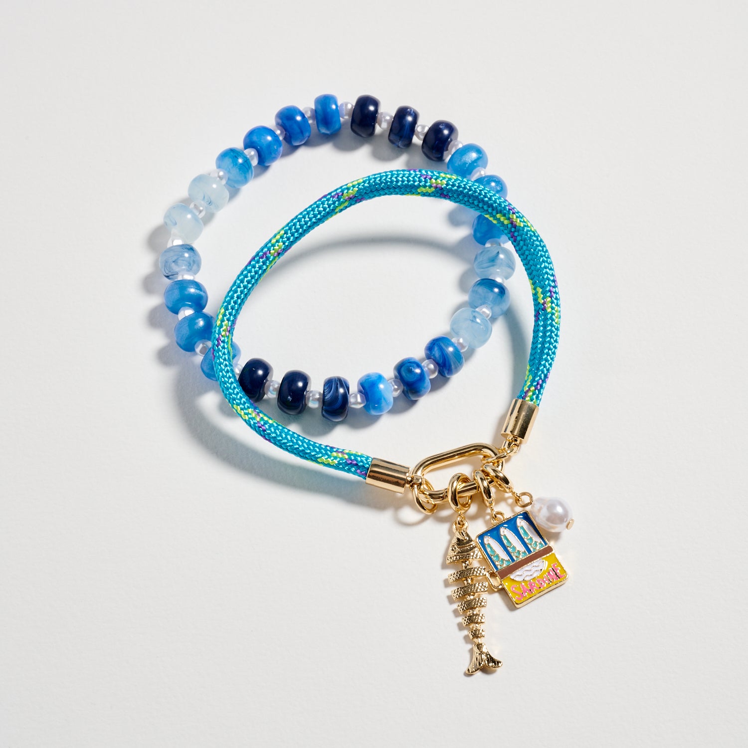 Double Layer Beaded Stretch & Cord Bracelet with Gold Tone Charms - Frem