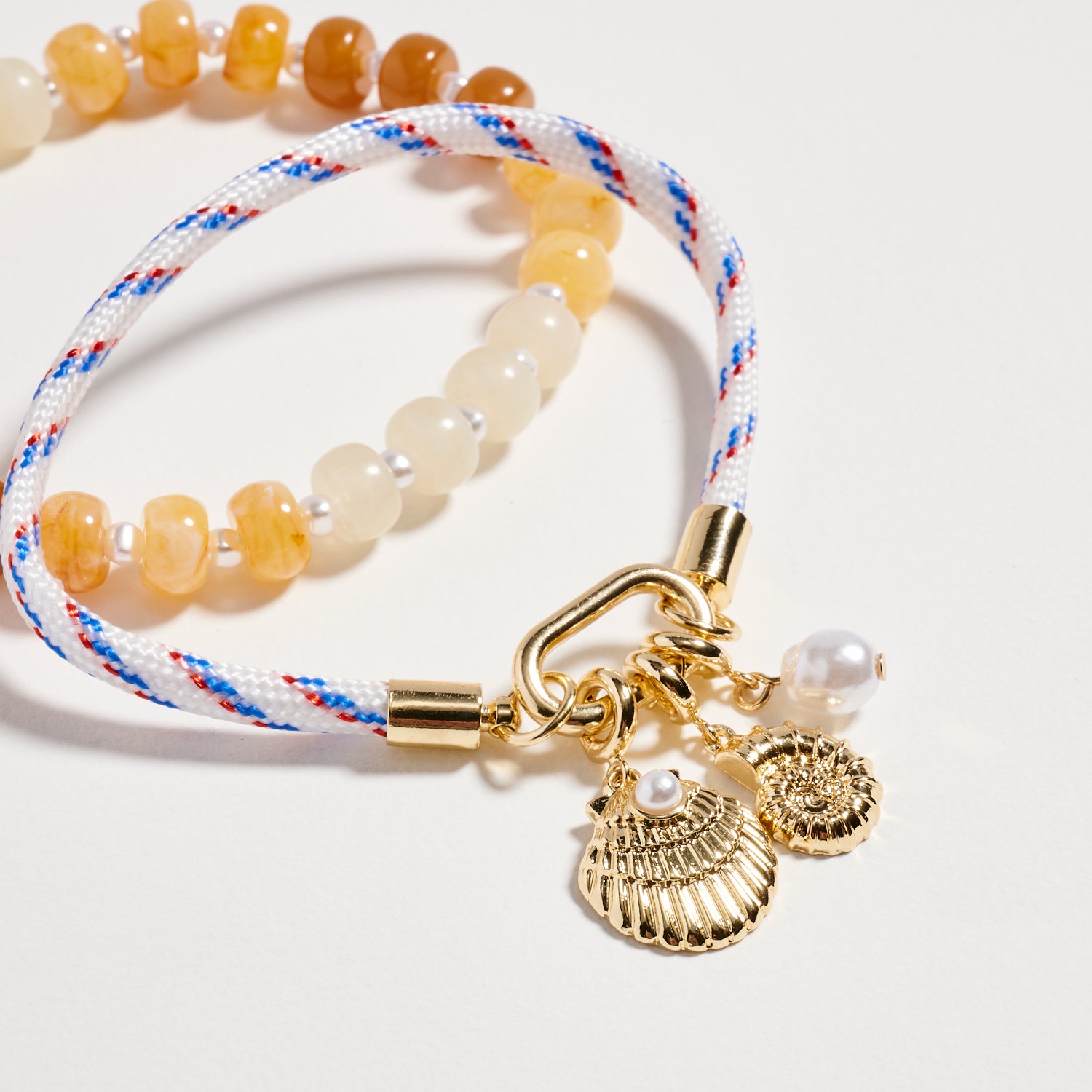 Double Layer Beaded Stretch & Cord Bracelet with Gold Tone Charms - Frem