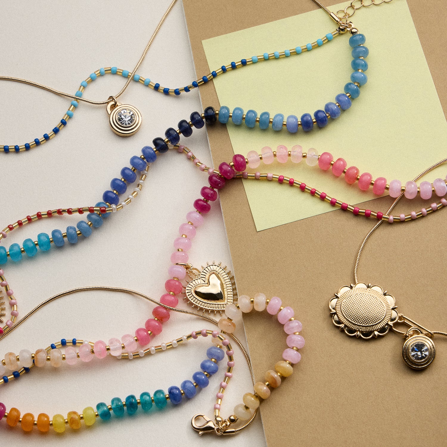 Layered Beaded and Pendant Necklace Set with Gold Accents – Heart and Charm Detail