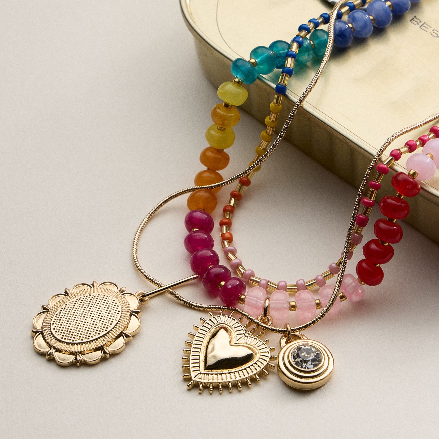 Layered Beaded and Pendant Necklace Set with Gold Accents – Heart and Charm Detail