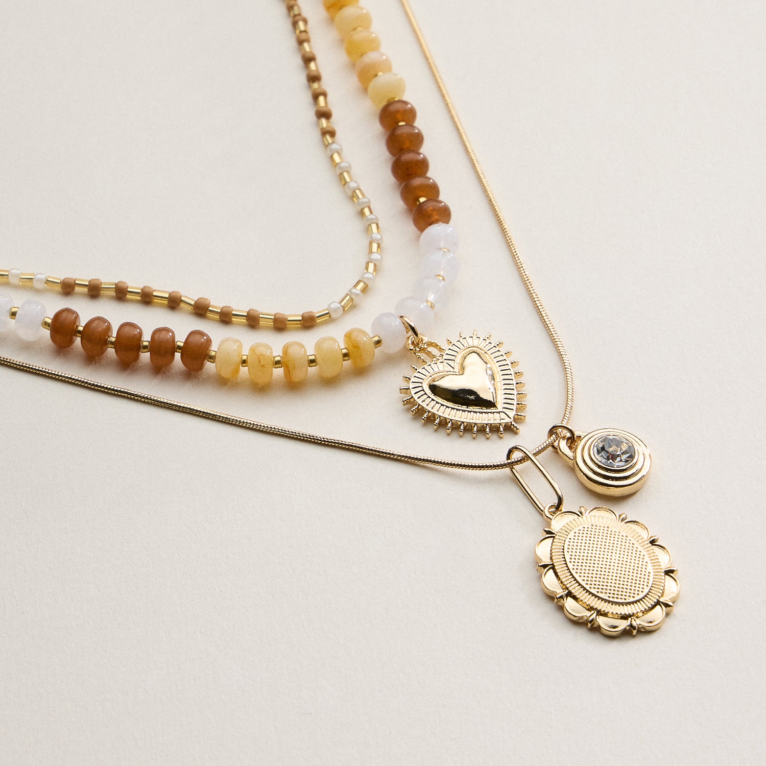 Layered Beaded and Pendant Necklace Set with Gold Accents – Heart and Charm Detail