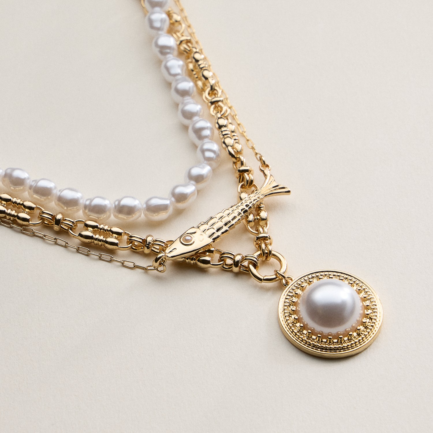 Layered Pearl and Chain Necklace with Round Pendant – Fish Link Detail