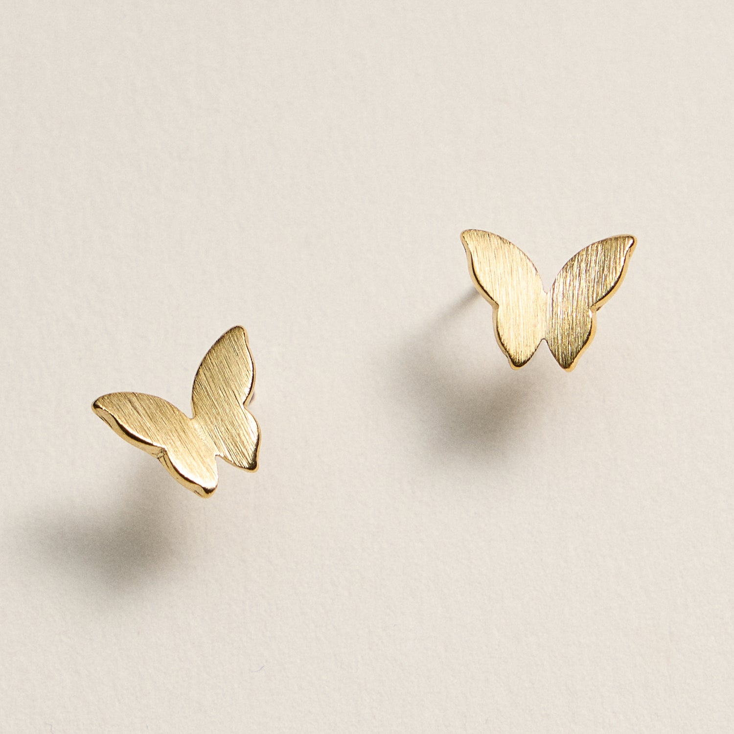 Gold Dipped Butterfly Stud Earrings – Minimalist Brushed Metal Design