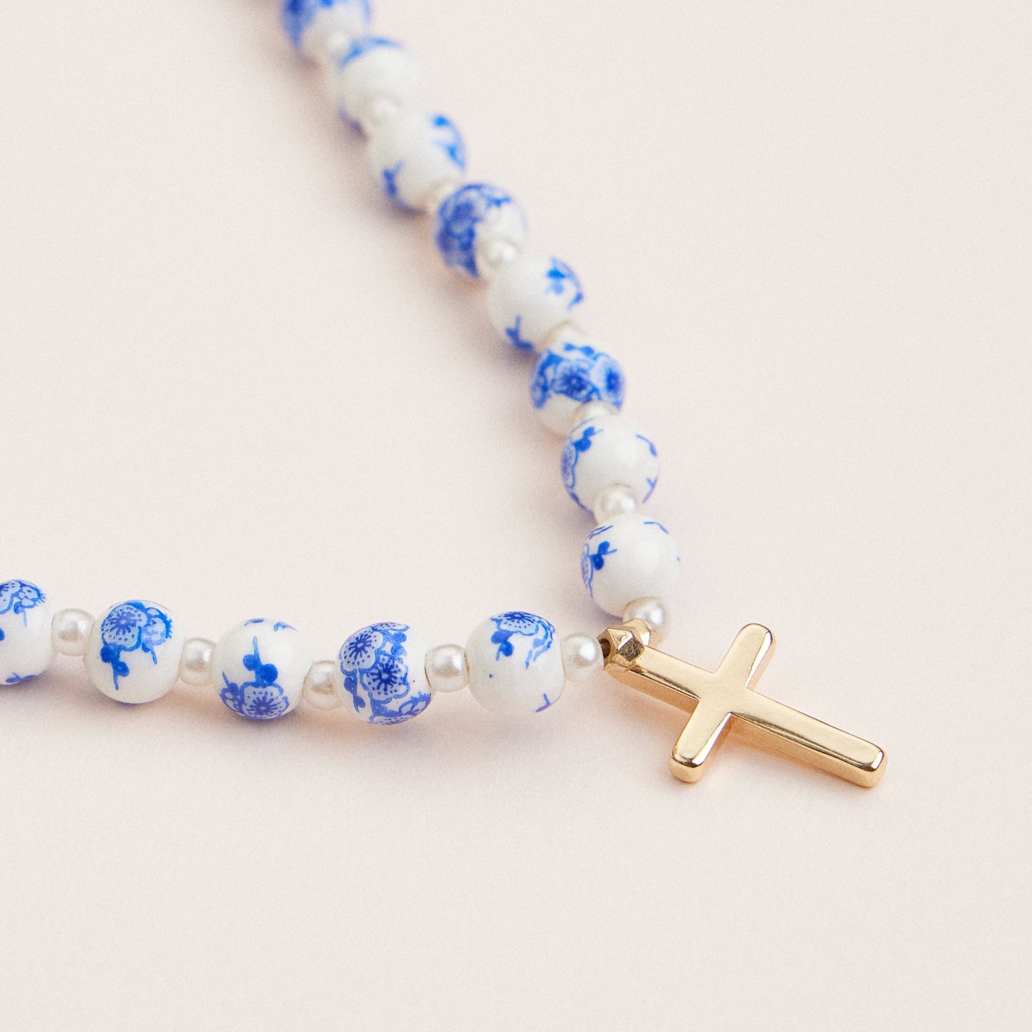 Elegant Blue and White Ceramic Beaded Necklace with Gold Cross Pendant