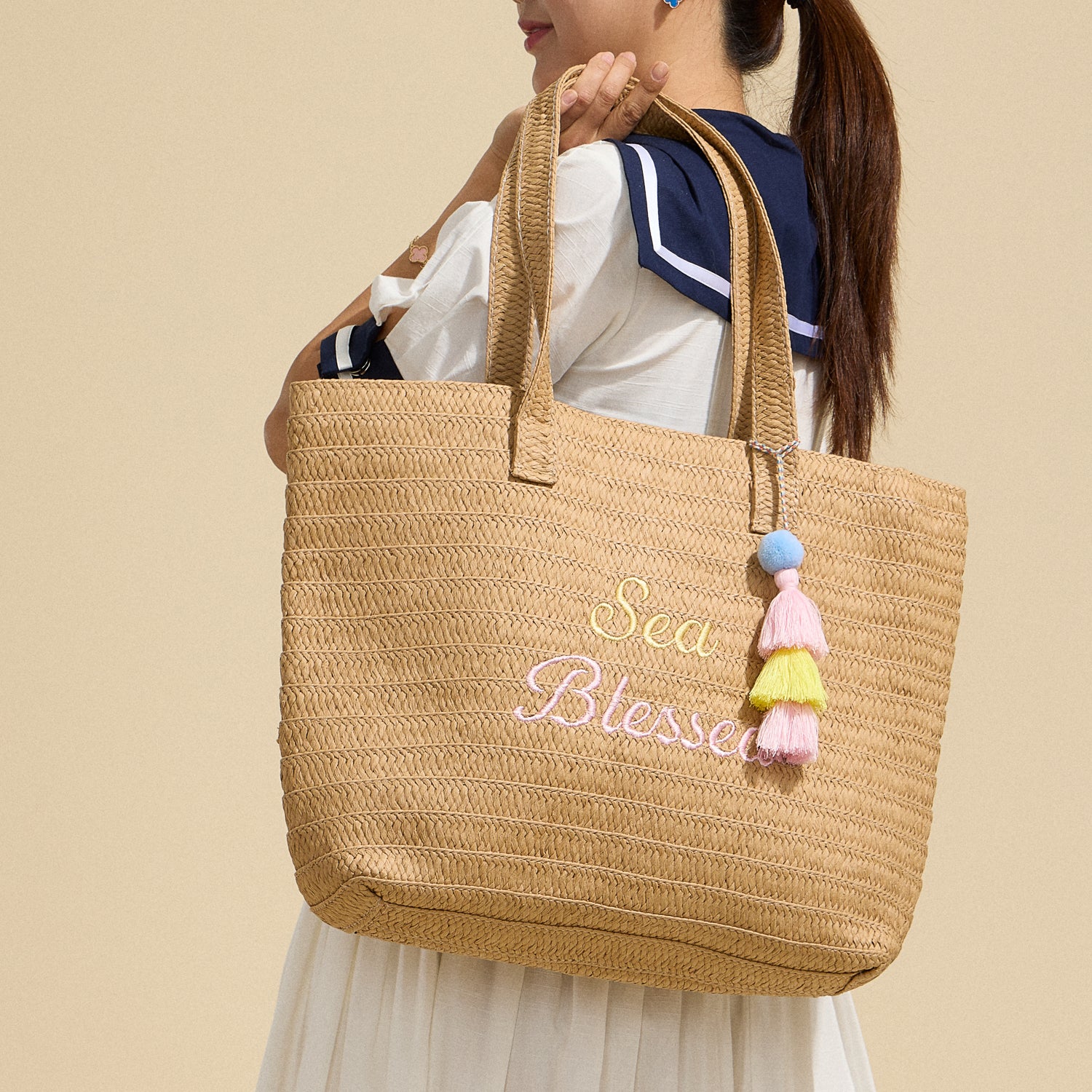 Sun Blessed Raffia Tote – Embroidered Woven Bag with Tassel Accent