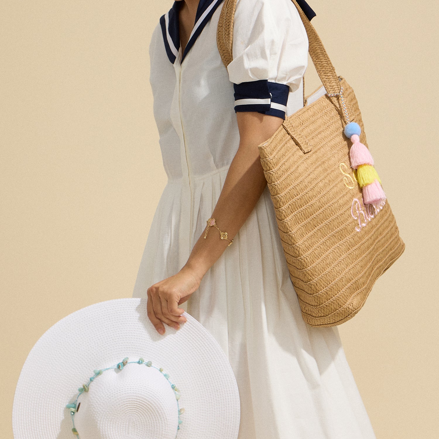 Sun Blessed Raffia Tote – Embroidered Woven Bag with Tassel Accent