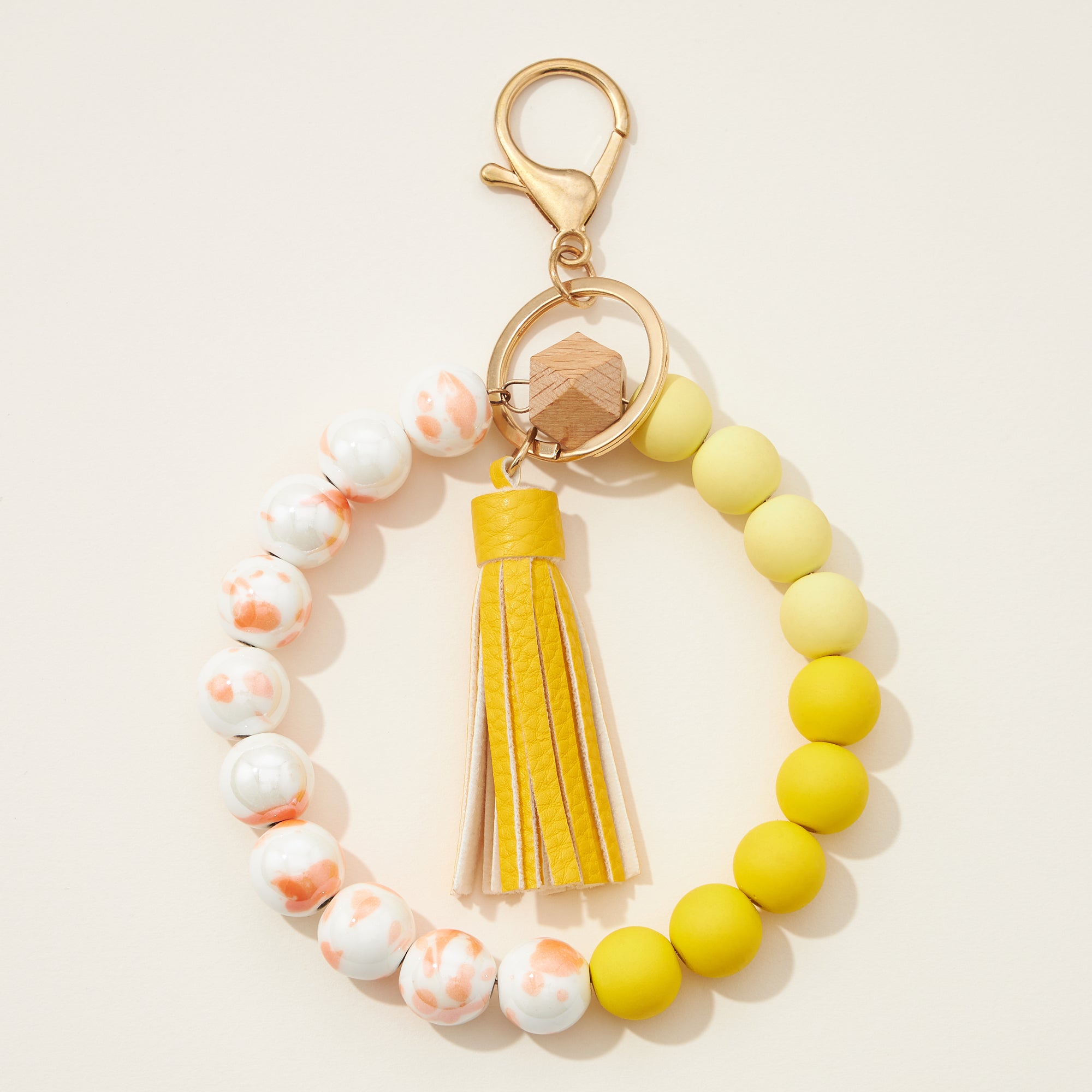 Ceramic and Silicone Coated Bead Bracelet Keychains with Tassel