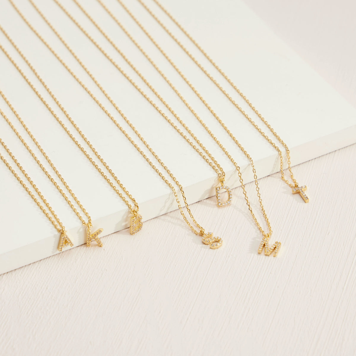 12 Gold-Plated Initial Necklaces with Cubic Zirconia Detailing