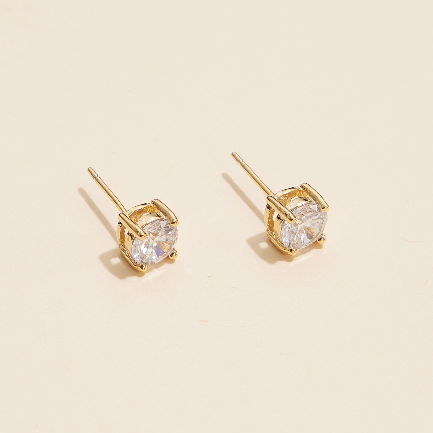 Sophisticated Gold and White Stud Earrings with Brilliant Gemstones