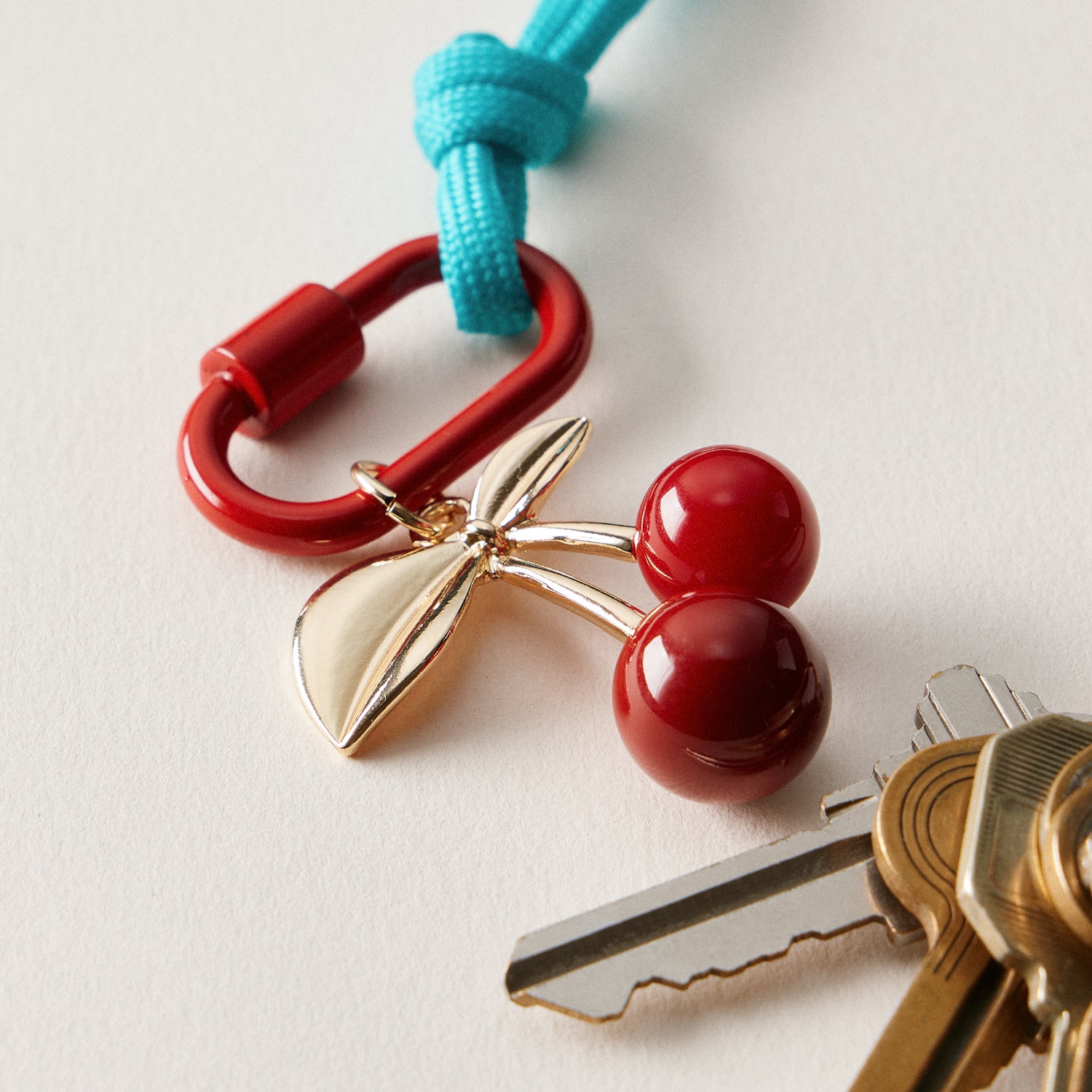 Gold-Tone Cherry Enamel Keychain | Braided Rope Detail