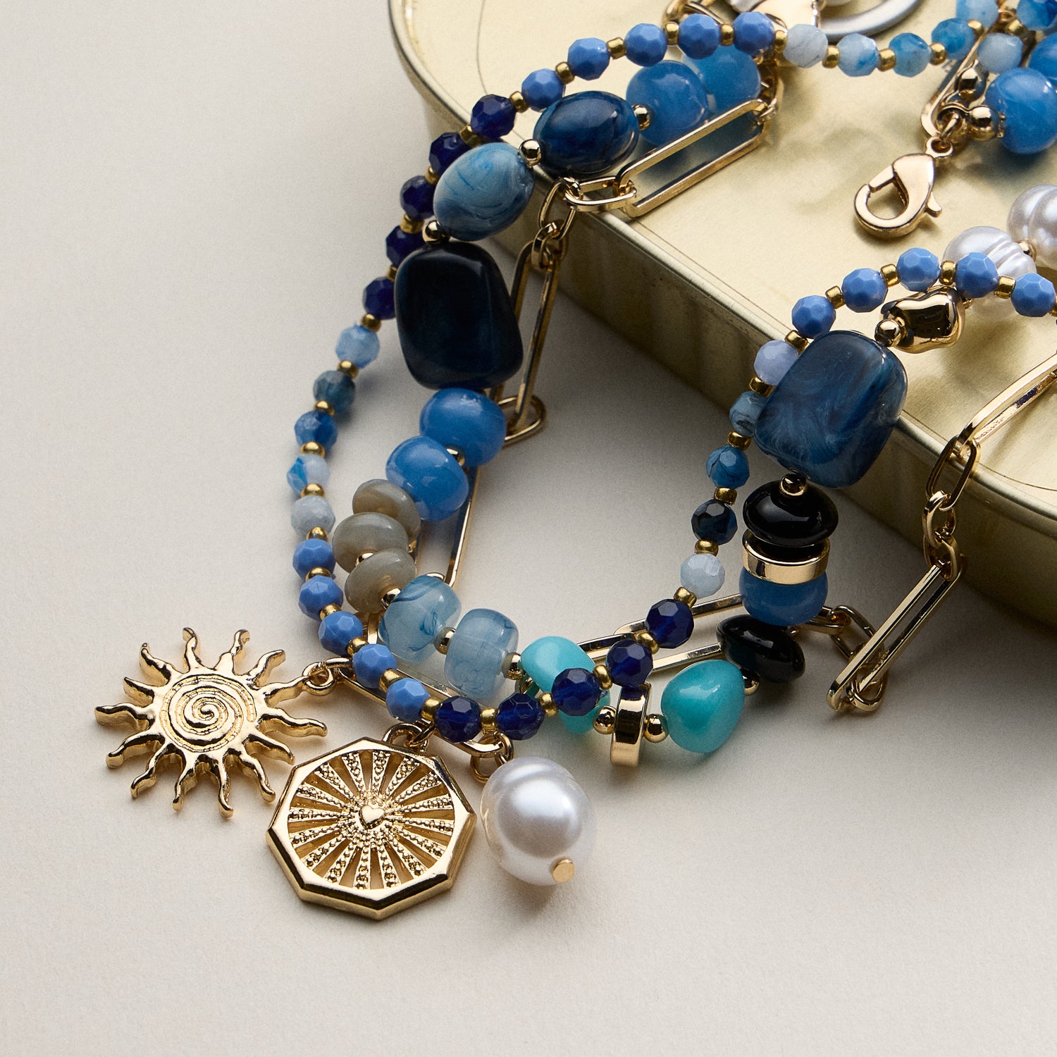 Layered Beaded and Chain Necklace with Sun and Pearl Charms – Gold Accent Design