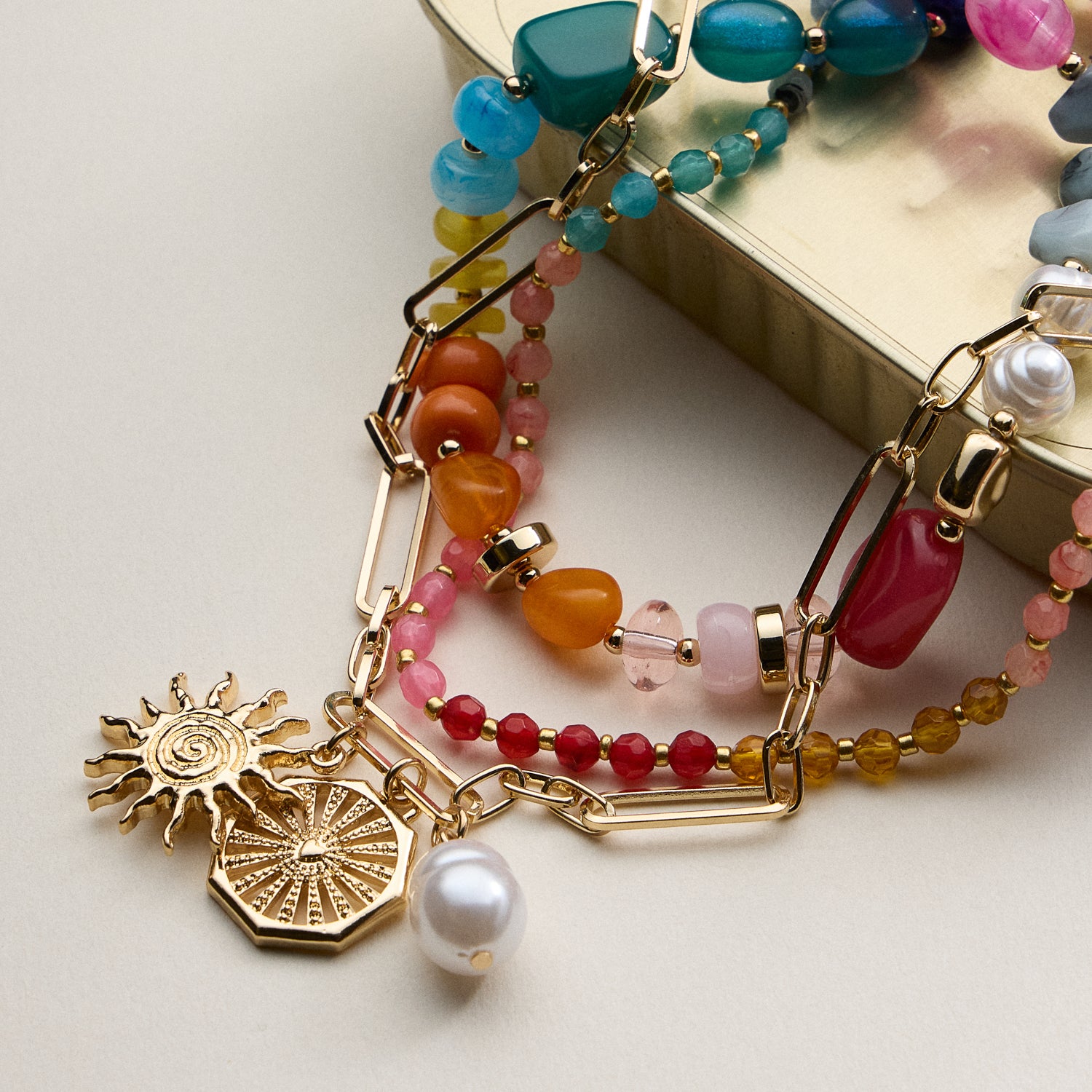 Layered Beaded and Chain Necklace with Sun and Pearl Charms – Gold Accent Design