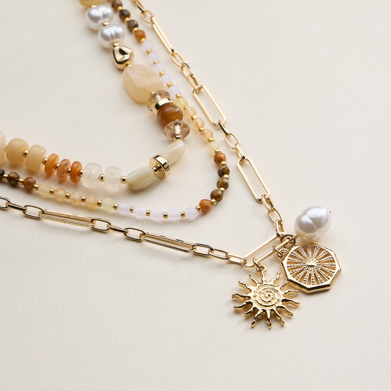 Layered Beaded and Chain Necklace with Sun and Pearl Charms – Gold Accent Design