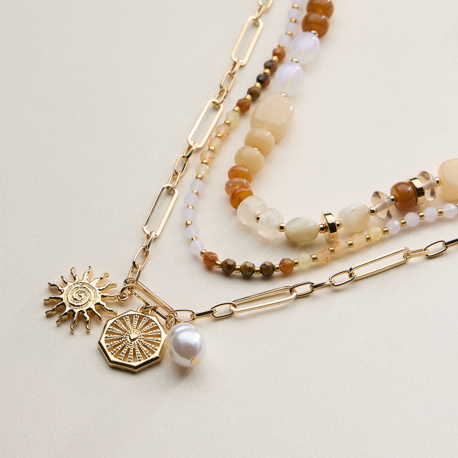 Layered Beaded and Chain Necklace with Sun and Pearl Charms – Gold Accent Design