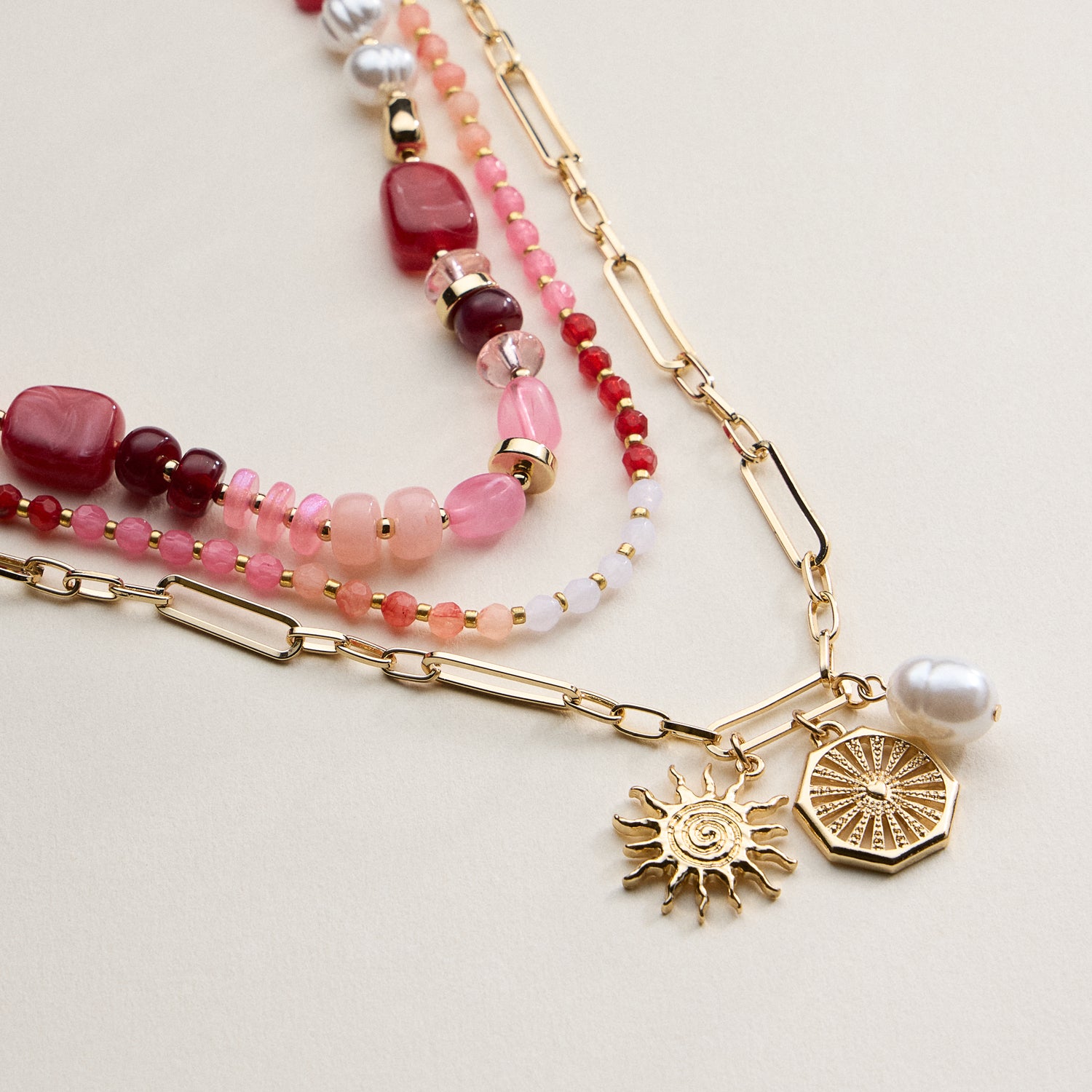 Layered Beaded and Chain Necklace with Sun and Pearl Charms – Gold Accent Design