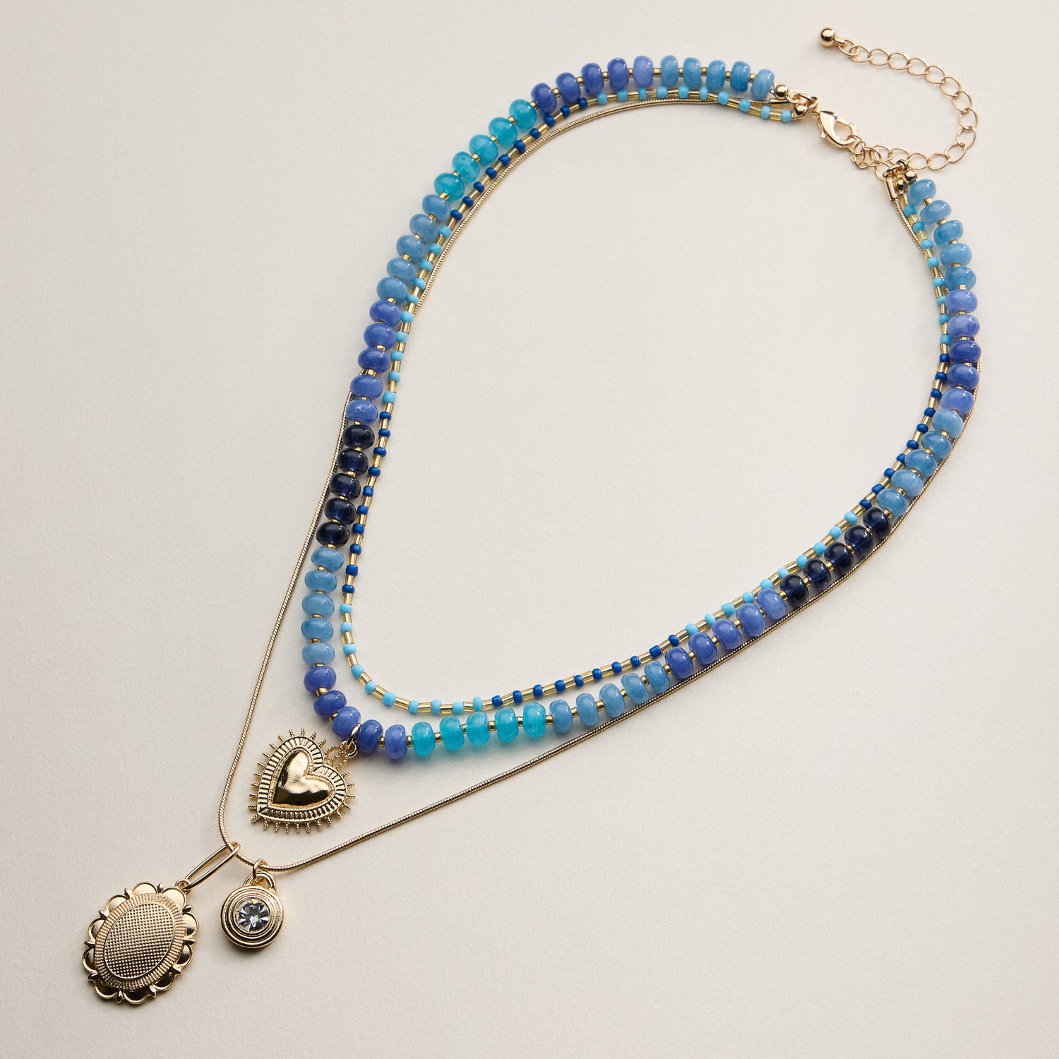 Layered Beaded and Pendant Necklace Set with Gold Accents – Heart and Charm Detail