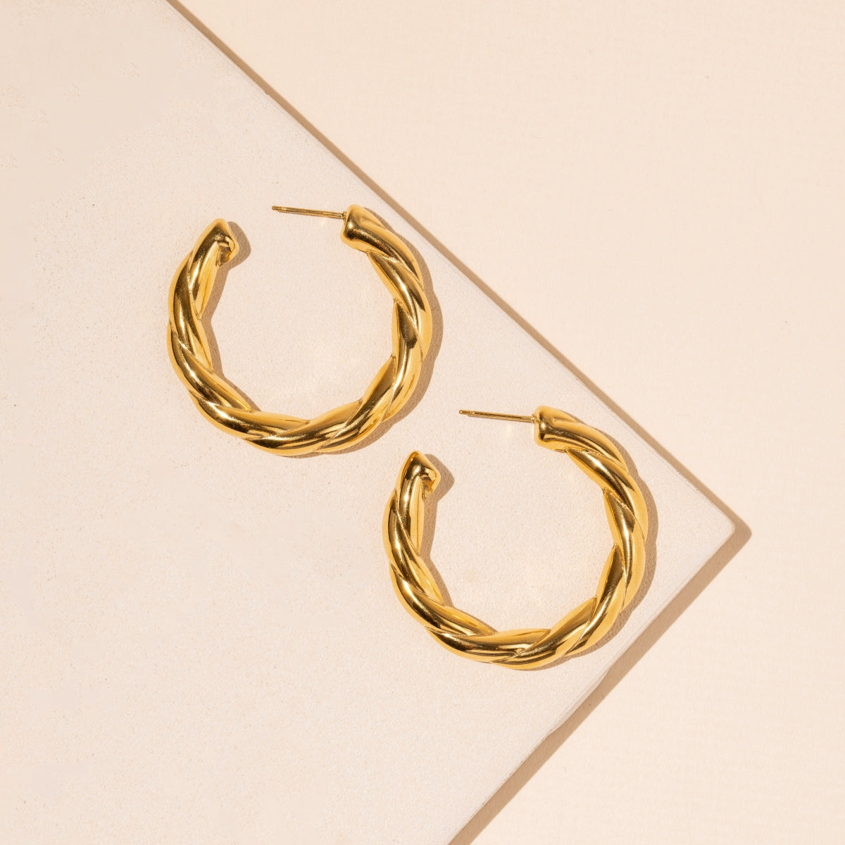 Twisted Gold Hoop Earrings in Stainless Steel