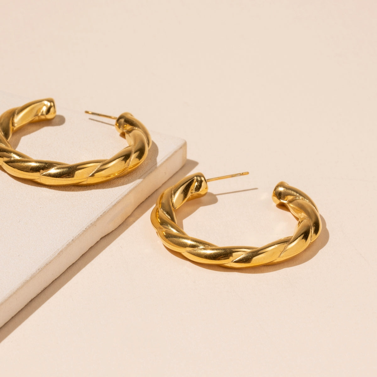 TWISTED GOLD HOOP EARRINGS