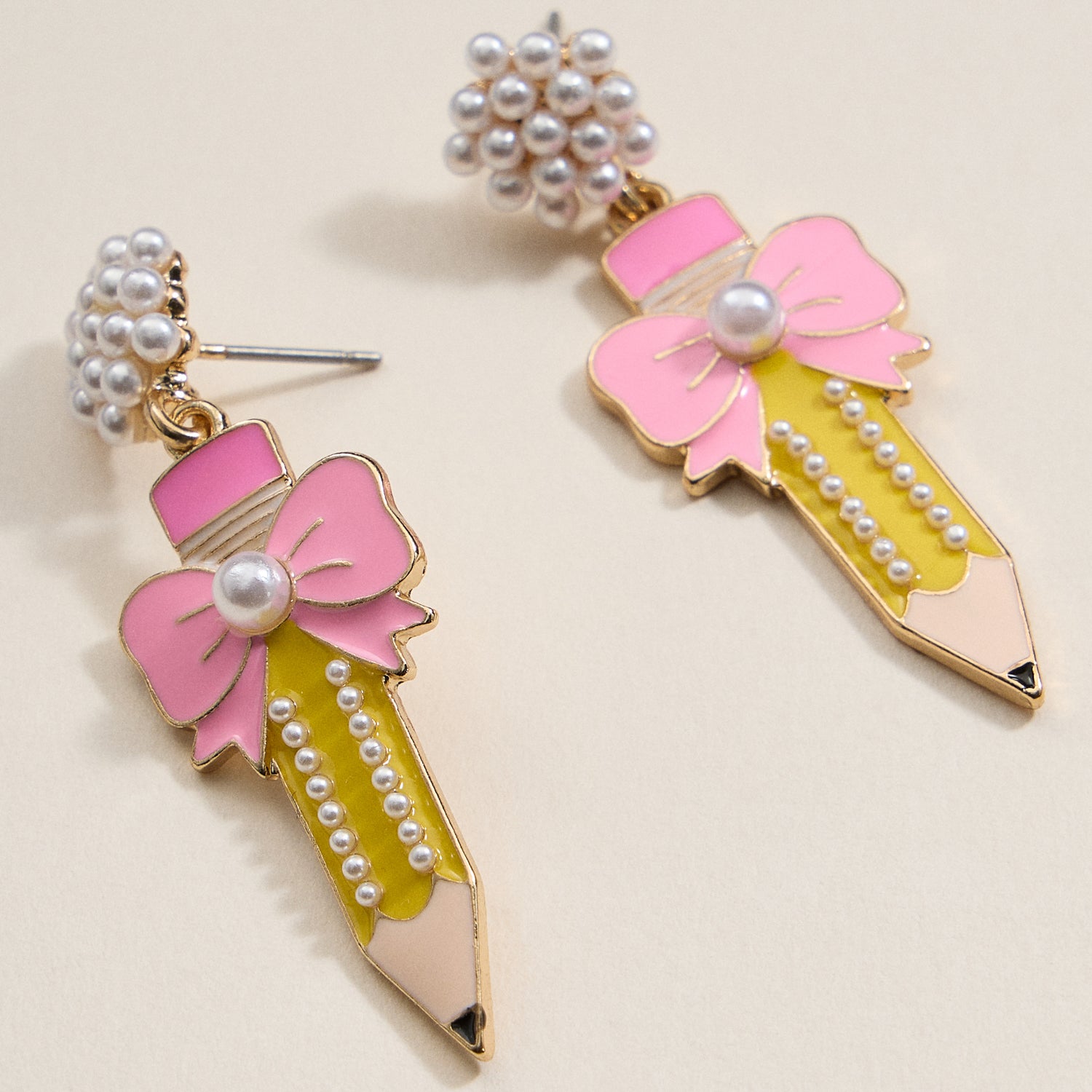 Elegant Pencil and Bow Pearl Earrings