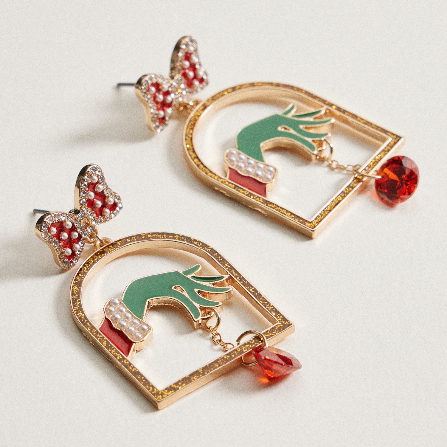 Enamel Green Monster Hand Earrings | Bow Christmas Dangles