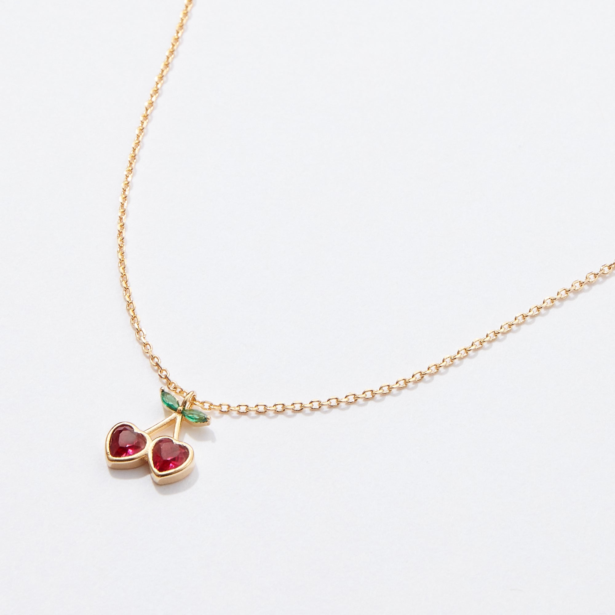 Gold Cherry Necklace with Heart-Shaped Red Stones & Green Leaf Accents – Dainty & Elegant Jewelry - Frem
