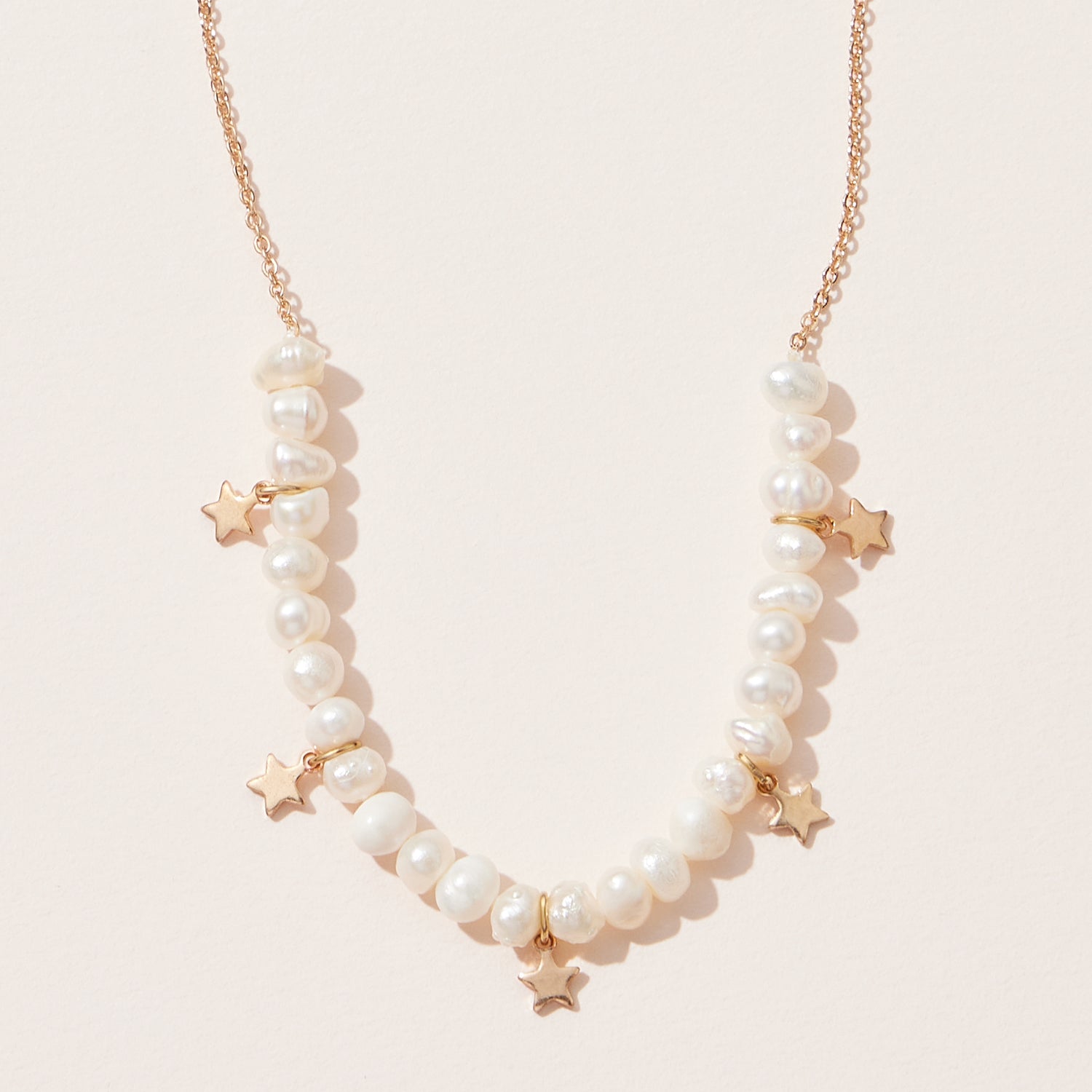 Elegant Pearl Necklace with Gold Star Charms